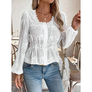 Vit broderad blus i broderie anglaise med ballongärm