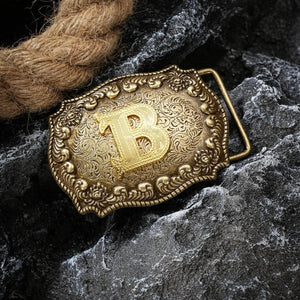 Bältespänne med bokstav i antik westernstil