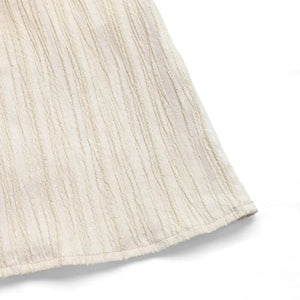 Beige klänning med volang