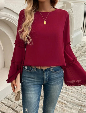 Blus med trumpetärm