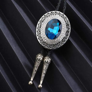 Bolo tie rund med blå rhinestone och flätad läderrem