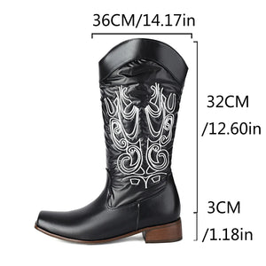 Cowboyboots med elegant broderi och glansig yta
