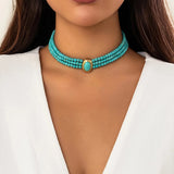 Flerradigt choker-halsband med turkosa pärlor Blå