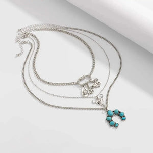 Flerradigt halsbandsset i western stil med turkos och cowboy-berlocker Silver med 3st