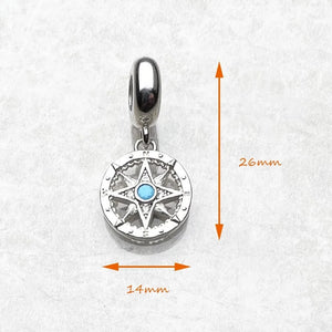 Kompass berlock i silver med turkos