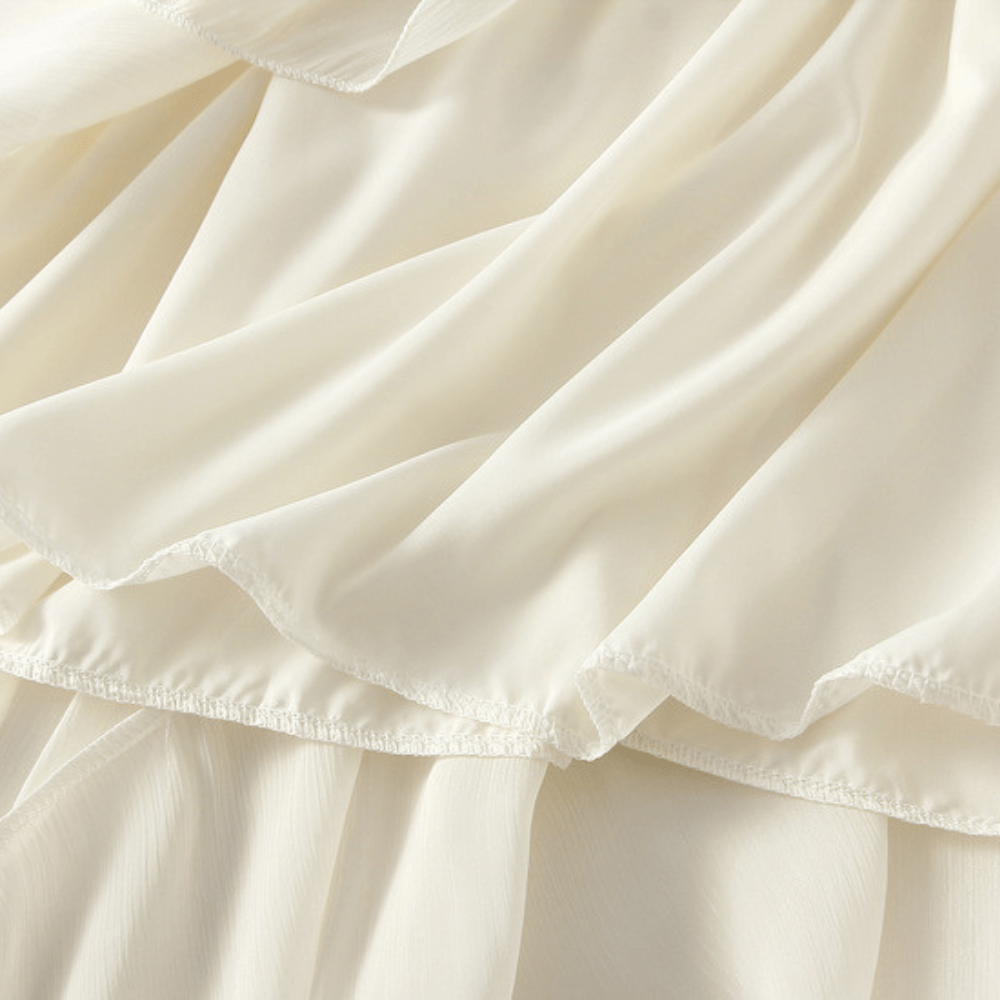 Midikjol med asymmetrisk drapering