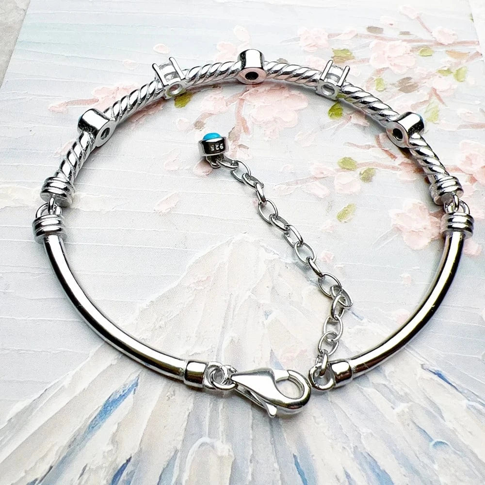 Stelt Silverarmband med Vriden Design och Turkosa Stenar Silver med turkos